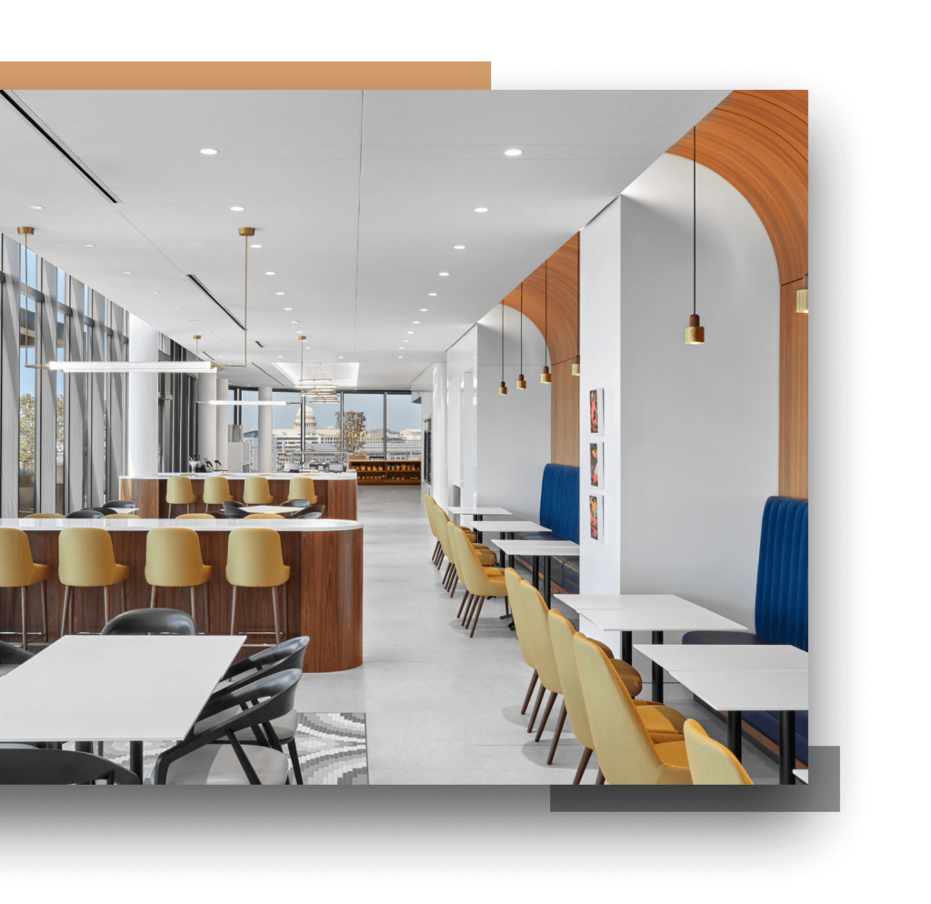 A hallway with several seating areas including tables with chairs and high-top tables